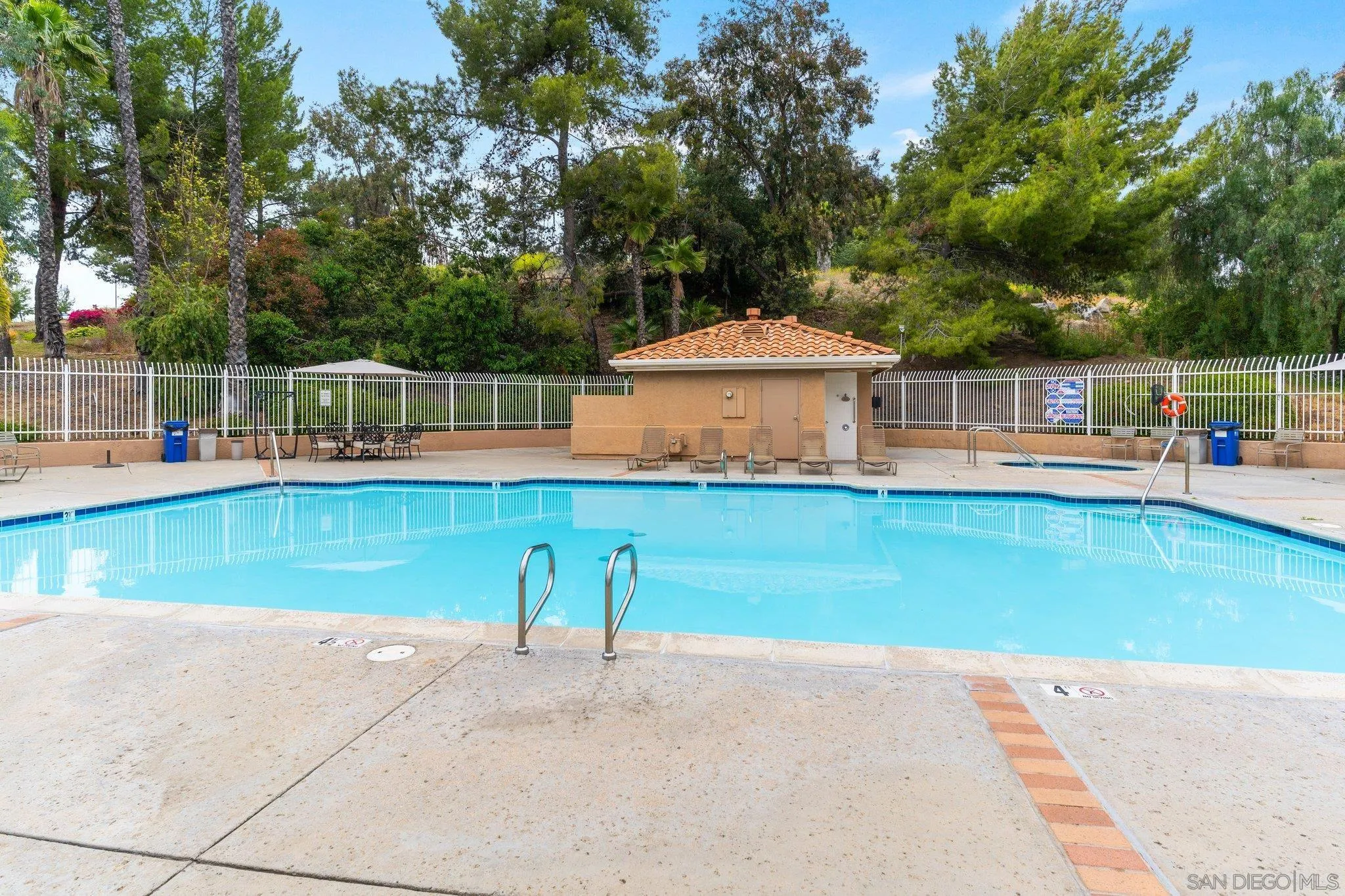 13801 Pinkard Way, Unit 8 El Cajon, CA 92021 - Photo 22 of 29 a view of a house with pool and chairs