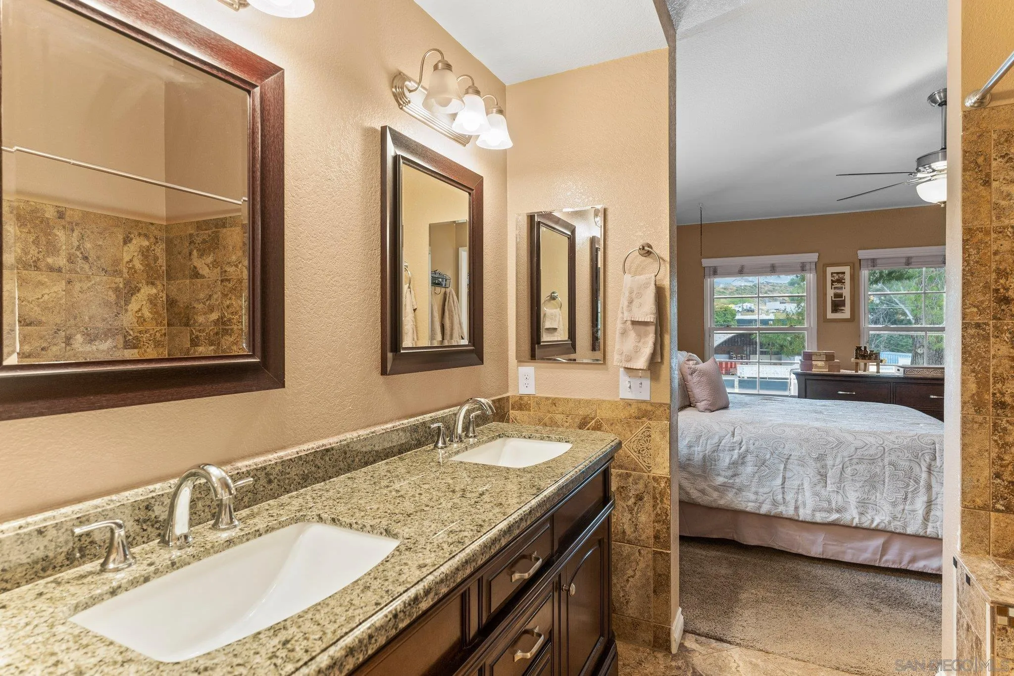 13801 Pinkard Way, Unit 8 El Cajon, CA 92021 - Photo 9 of 29 a en suite bathroom with sinks granite countertop tub and a mirror