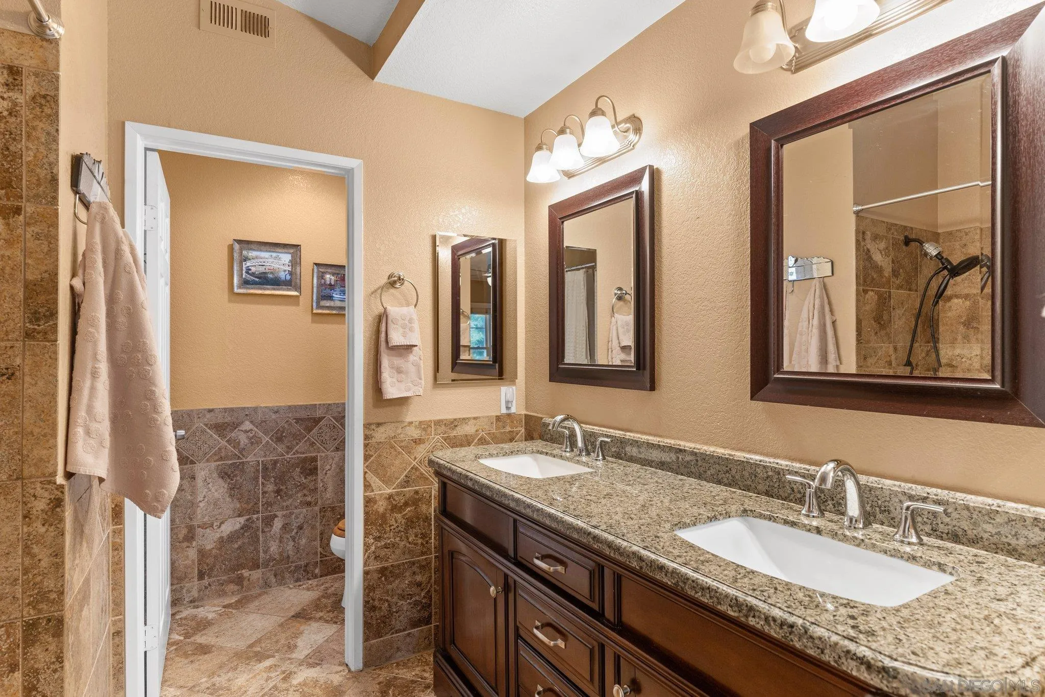 13801 Pinkard Way, Unit 8 El Cajon, CA 92021 - Photo 10 of 29 a bathroom with sinks granite countertop a sink and a mirror