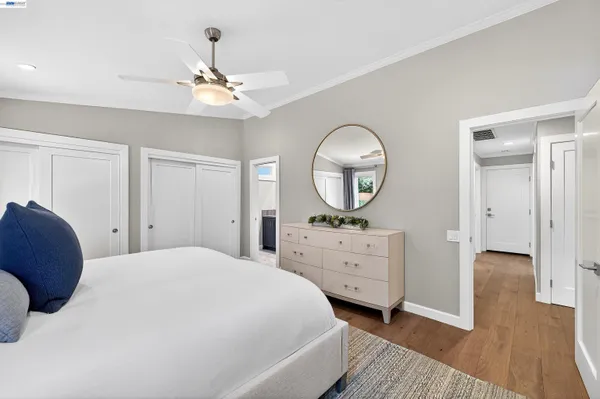 a bedroom with a bed and a dresser