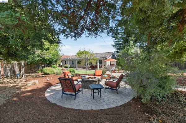 a view of a patio with a table and chairs