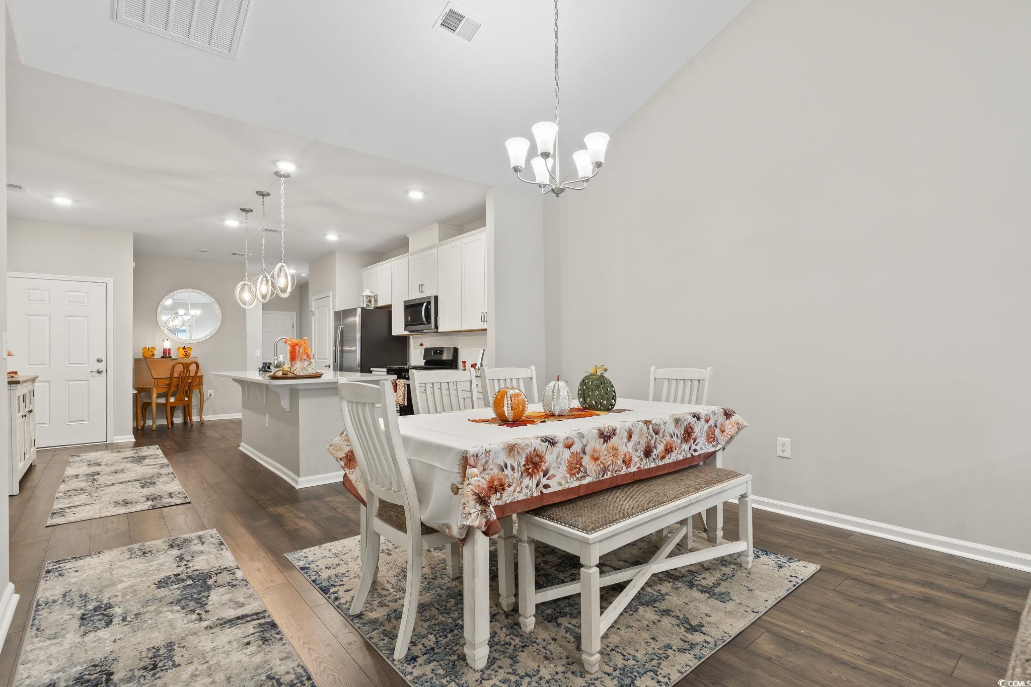 4040 Taranto Loop, Unit 5303C Myrtle Beach, SC 29579 - Photo 12 of 38 Dining area with a chandelier, dark wood-type flooring, and recessed lighting