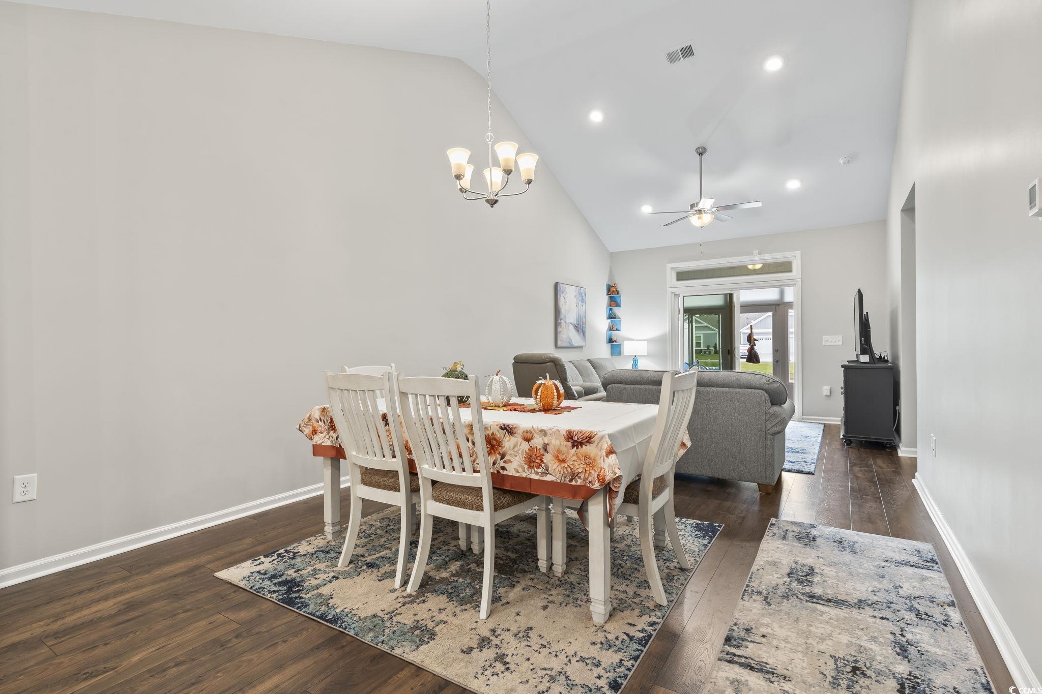 4040 Taranto Loop, Unit 5303C Myrtle Beach, SC 29579 - Photo 13 of 38 Dining space featuring dark wood-style floors, high vaulted ceiling, a chandelier, ceiling fan, and recessed lighting