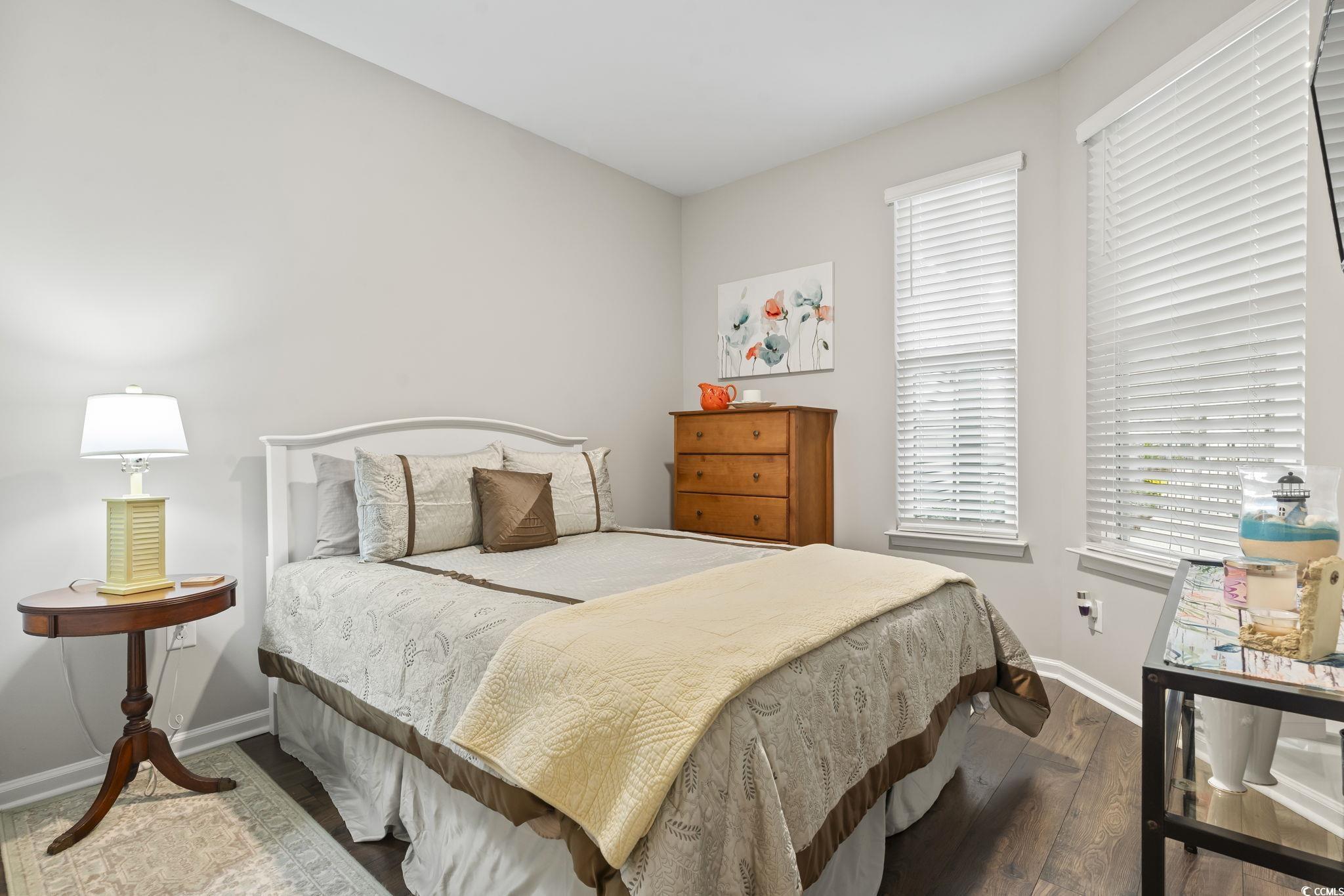 4040 Taranto Loop, Unit 5303C Myrtle Beach, SC 29579 - Photo 18 of 38 Bedroom featuring hardwood / wood-style floors and baseboards