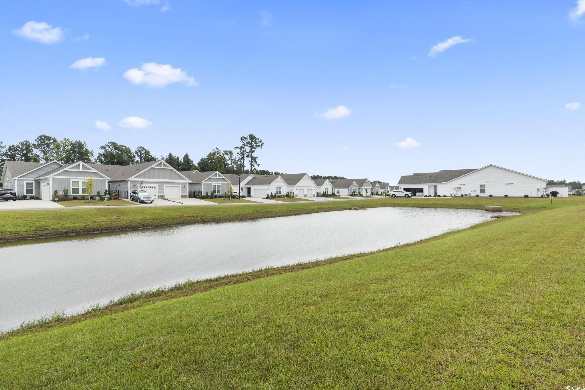 4040 Taranto Loop, Unit 5303C Myrtle Beach, SC 29579 - Photo 32 of 38 View of asphalt street with a water view and a residential view