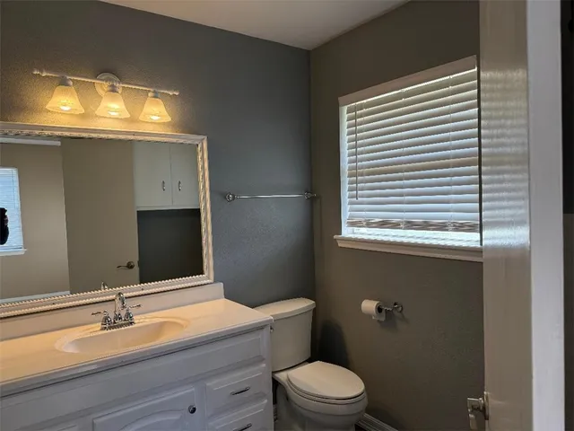 a bathroom with a sink and a toilet