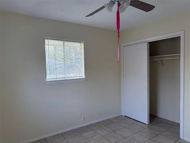 a very nice looking room with a ceiling fan