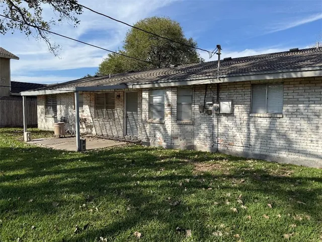 a backyard of a house with lots of green space