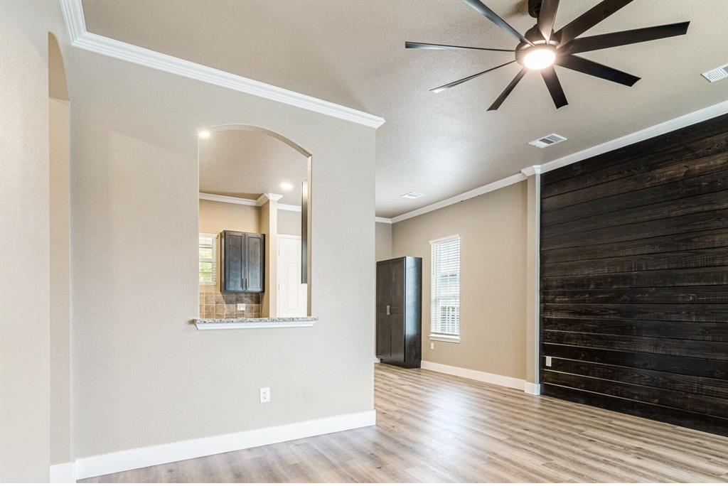 413 Henderson Street Bonham, TX 75418 - Photo 2 of 27 a view of an empty room and wooden floor