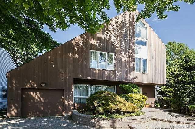 217 Stuart Road Valley Stream, NY 11581 - Photo 1 of 1 a front view of a house with plants