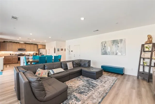 a living room with furniture and a rug
