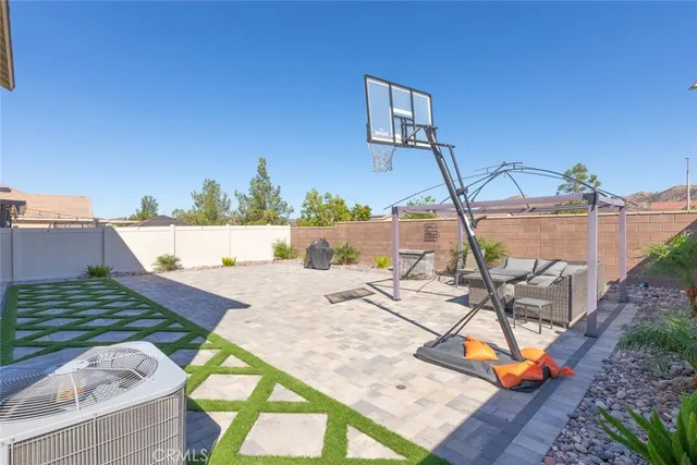 a view of a swimming pool with a patio