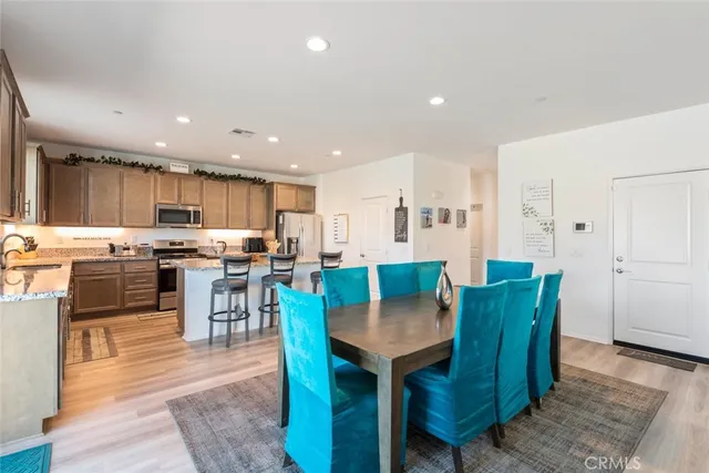 a view of kitchen with dining table and chairs
