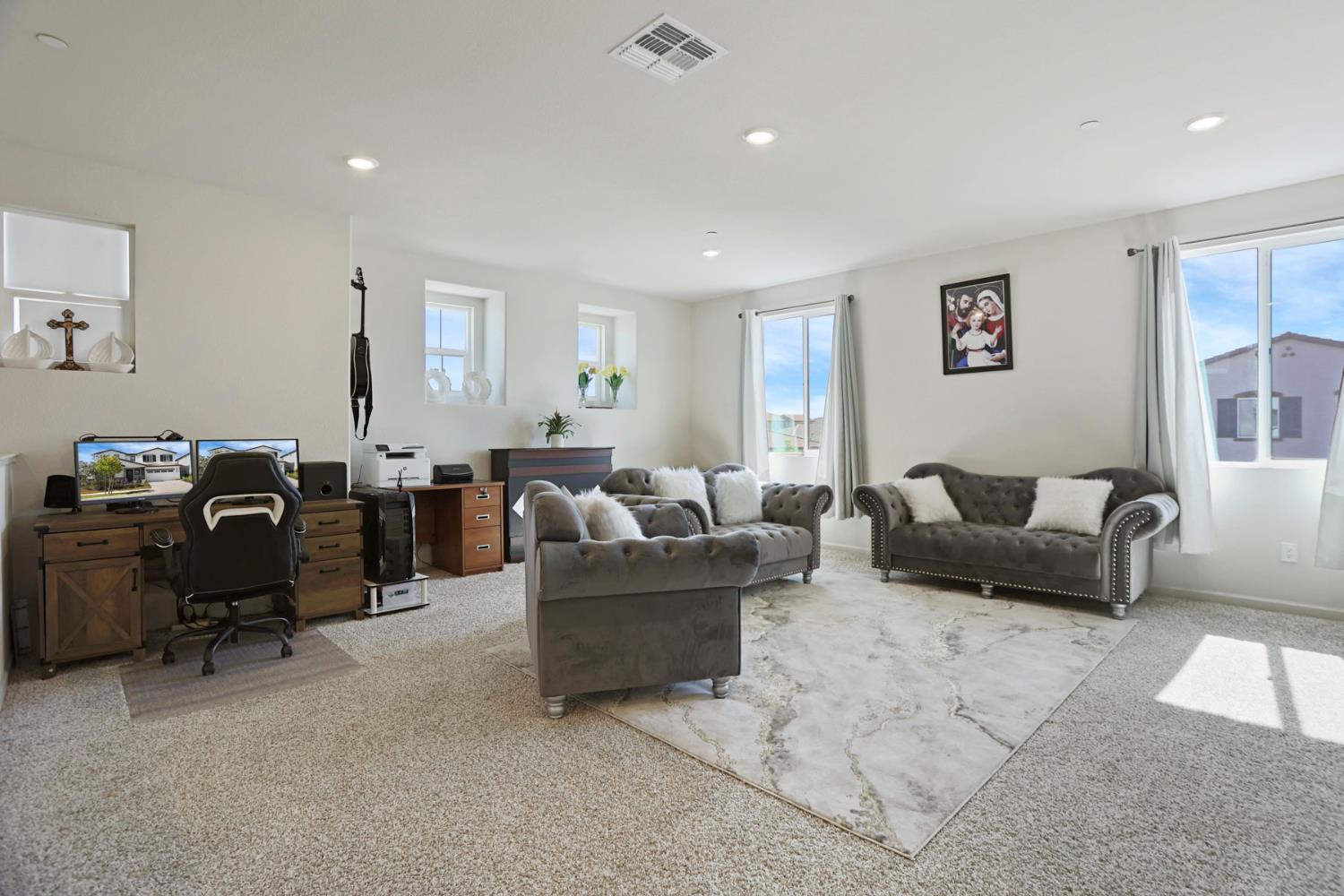 6949 Foraker Drive Stockton, CA 95219 - Photo 19 of 34 a living room with furniture and a large window