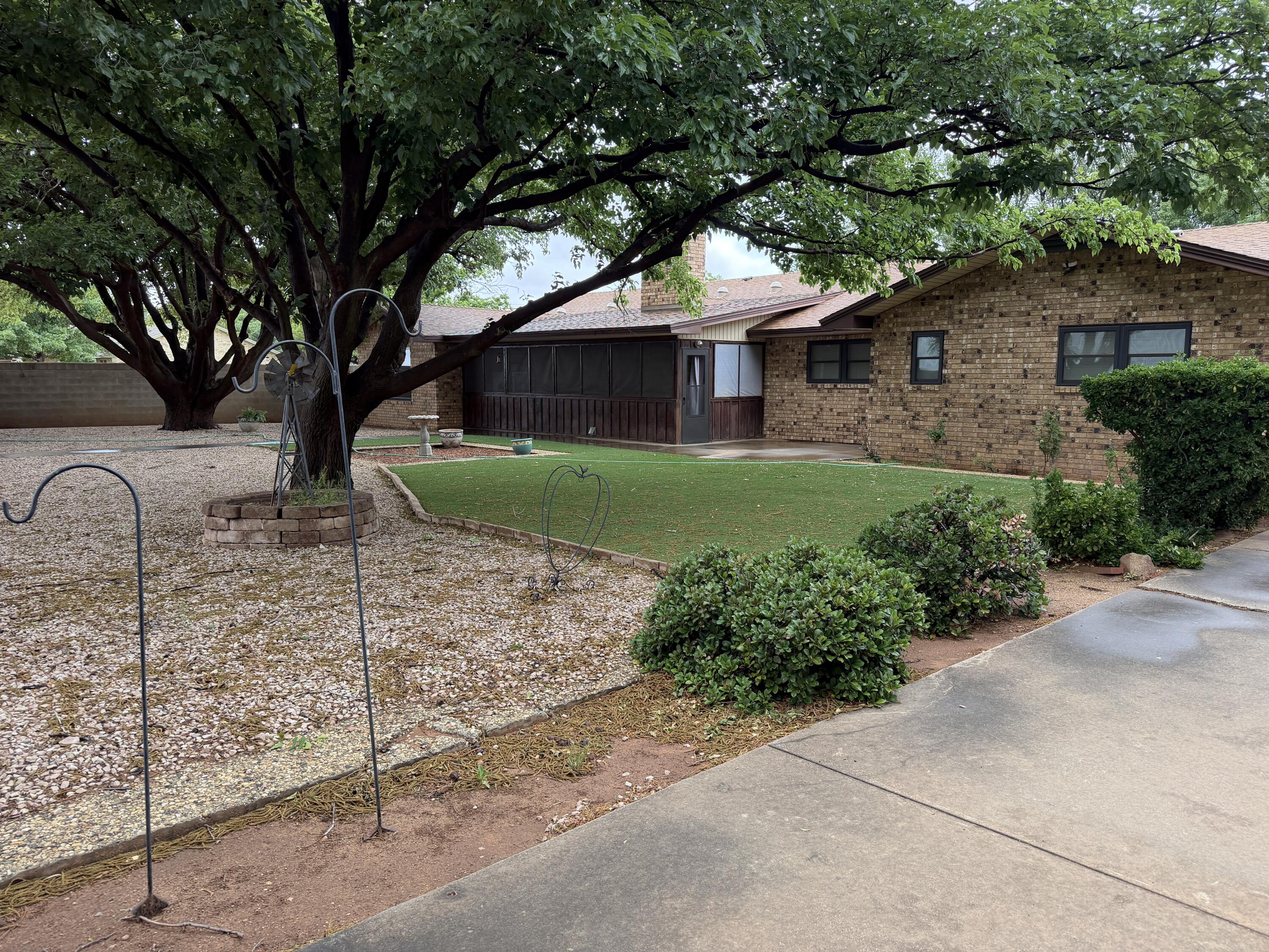 1603 South 8th Street Lamesa, TX 79331 - Photo 33 of 39 a front view of a house with garden