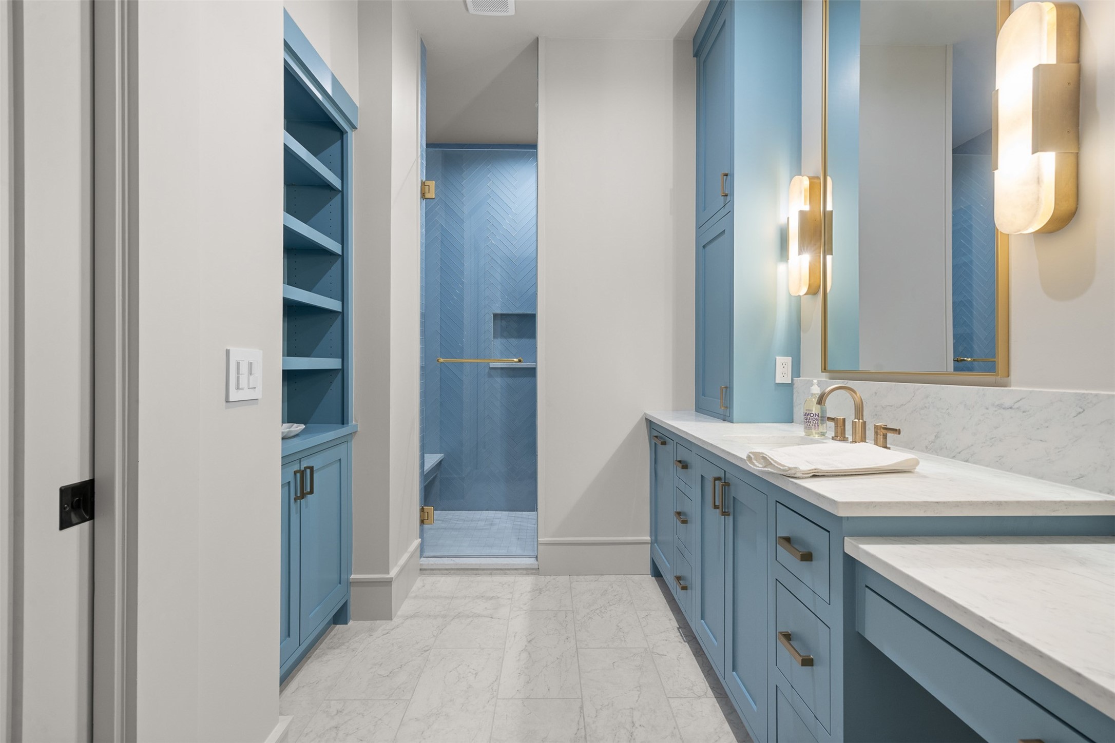 770 South Weyand Road Round Top, TX 78954 - Photo 33 of 50 a spacious bathroom with a double vanity sink and a mirror