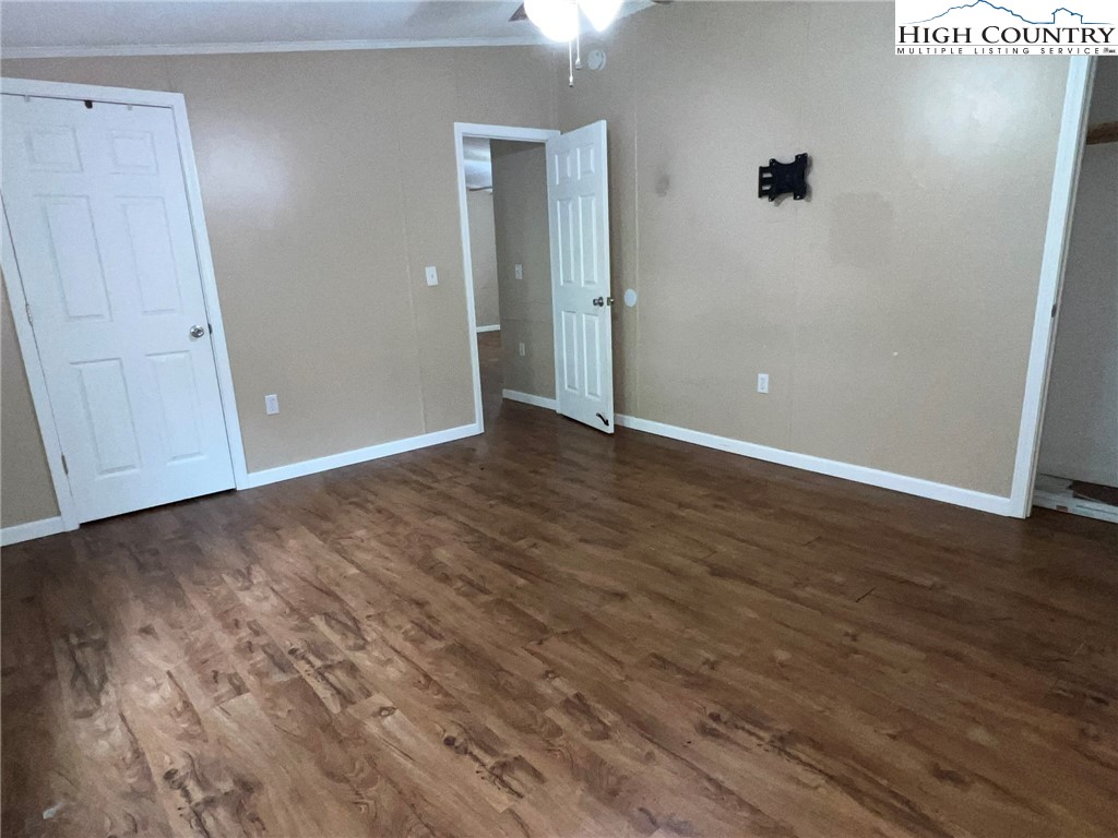 1980 Mountaindale Road Vilas, NC 28692 - Photo 14 of 25 a view of an empty room with wooden floor
