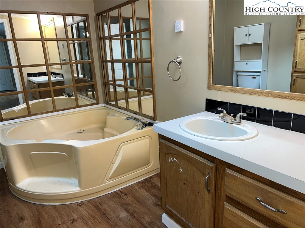 1980 Mountaindale Road Vilas, NC 28692 - Photo 17 of 25 a bathroom with a sink and a bathtub