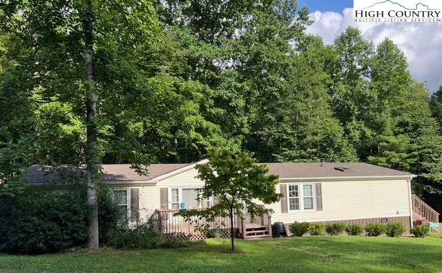 1980 Mountaindale Road Vilas, NC 28692 - Photo 2 of 25 a front view of a house with a garden