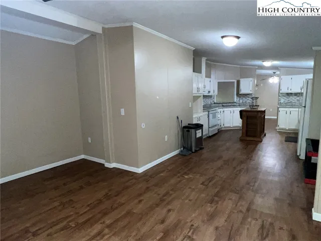 a view of kitchen with cabinets and wooden floor