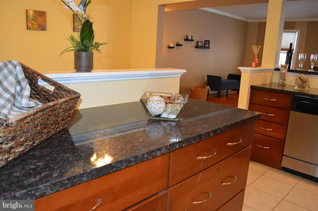 a kitchen with stainless steel appliances granite countertop a stove microwave and oven