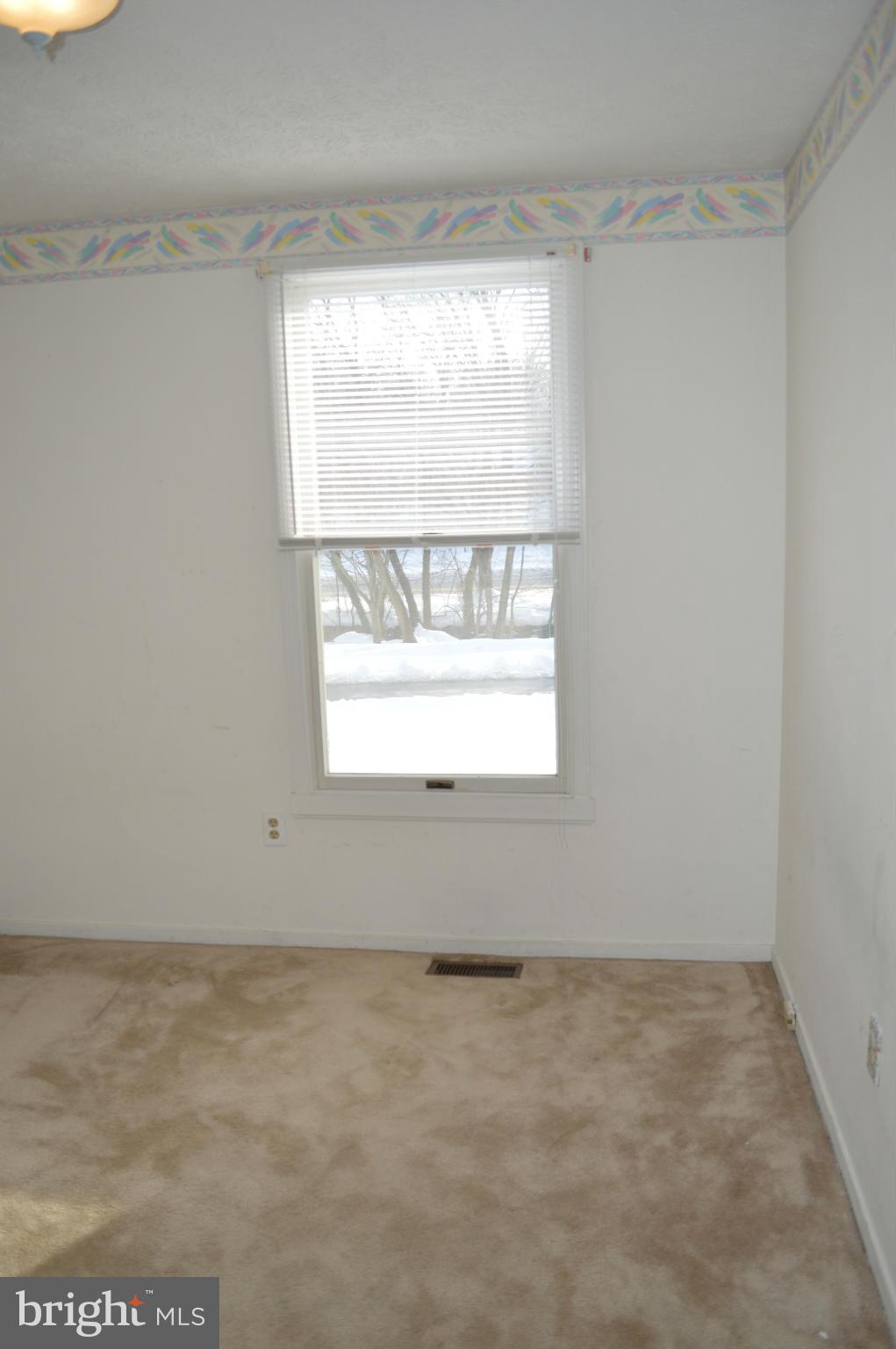 6111 Western Run Drive Baltimore, MD 21209 - Photo 18 of 27 a view of empty room with window