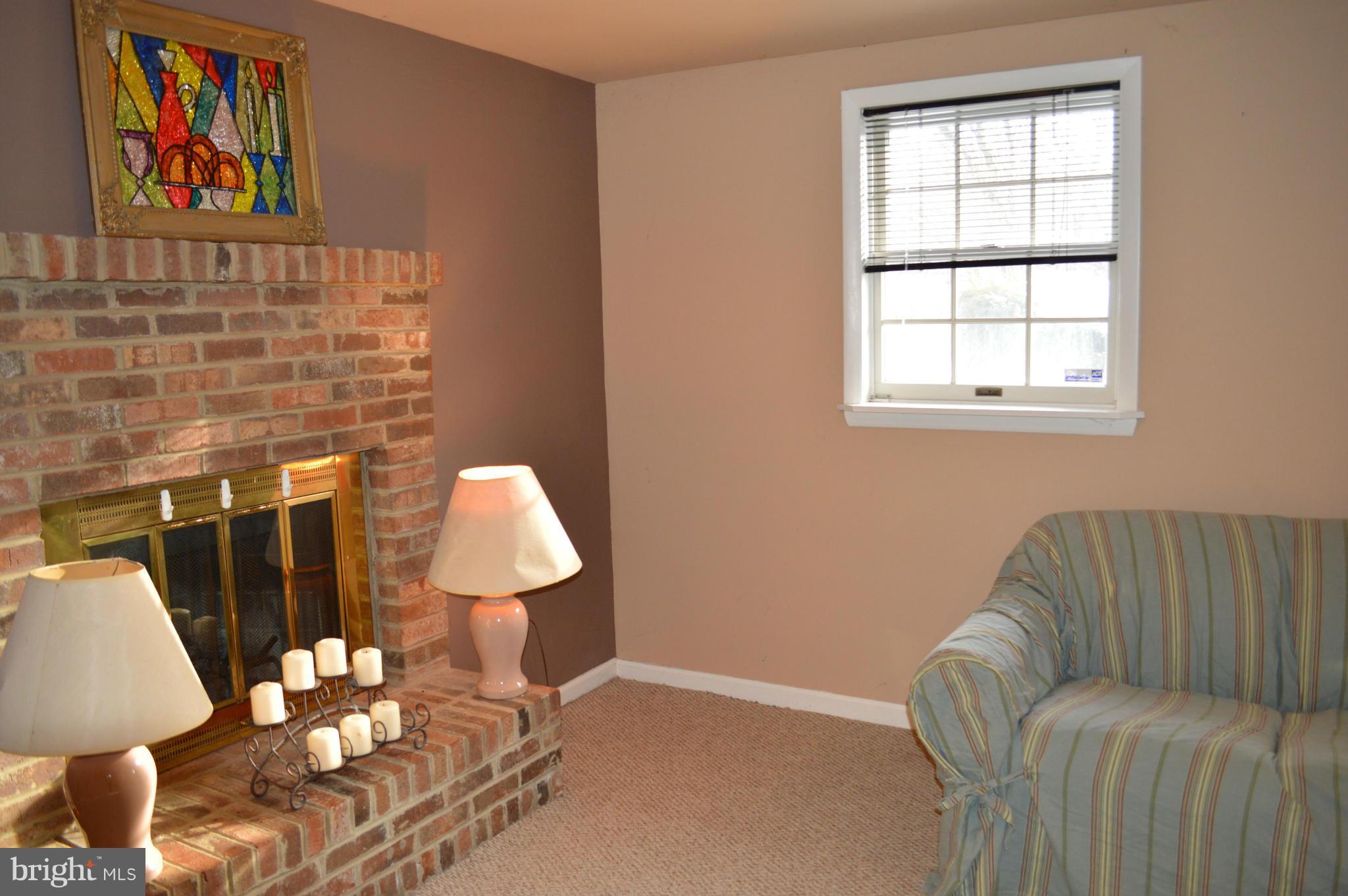 6111 Western Run Drive Baltimore, MD 21209 - Photo 20 of 27 a living room with furniture flowerpot and window