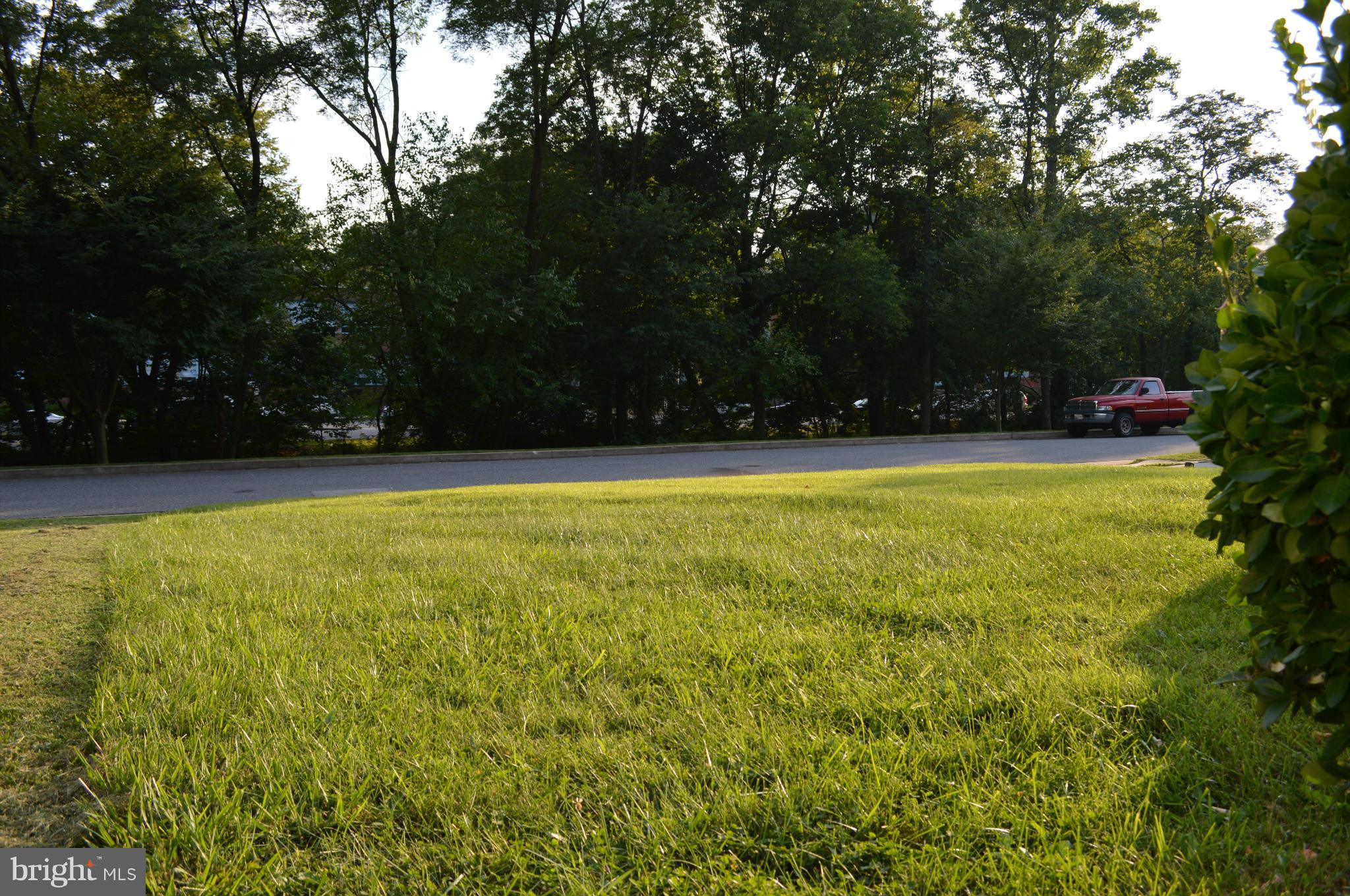 6111 Western Run Drive Baltimore, MD 21209 - Photo 22 of 27 a view of a swimming pool and trees in the background