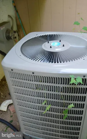 a table with wine bottles and glasses on it