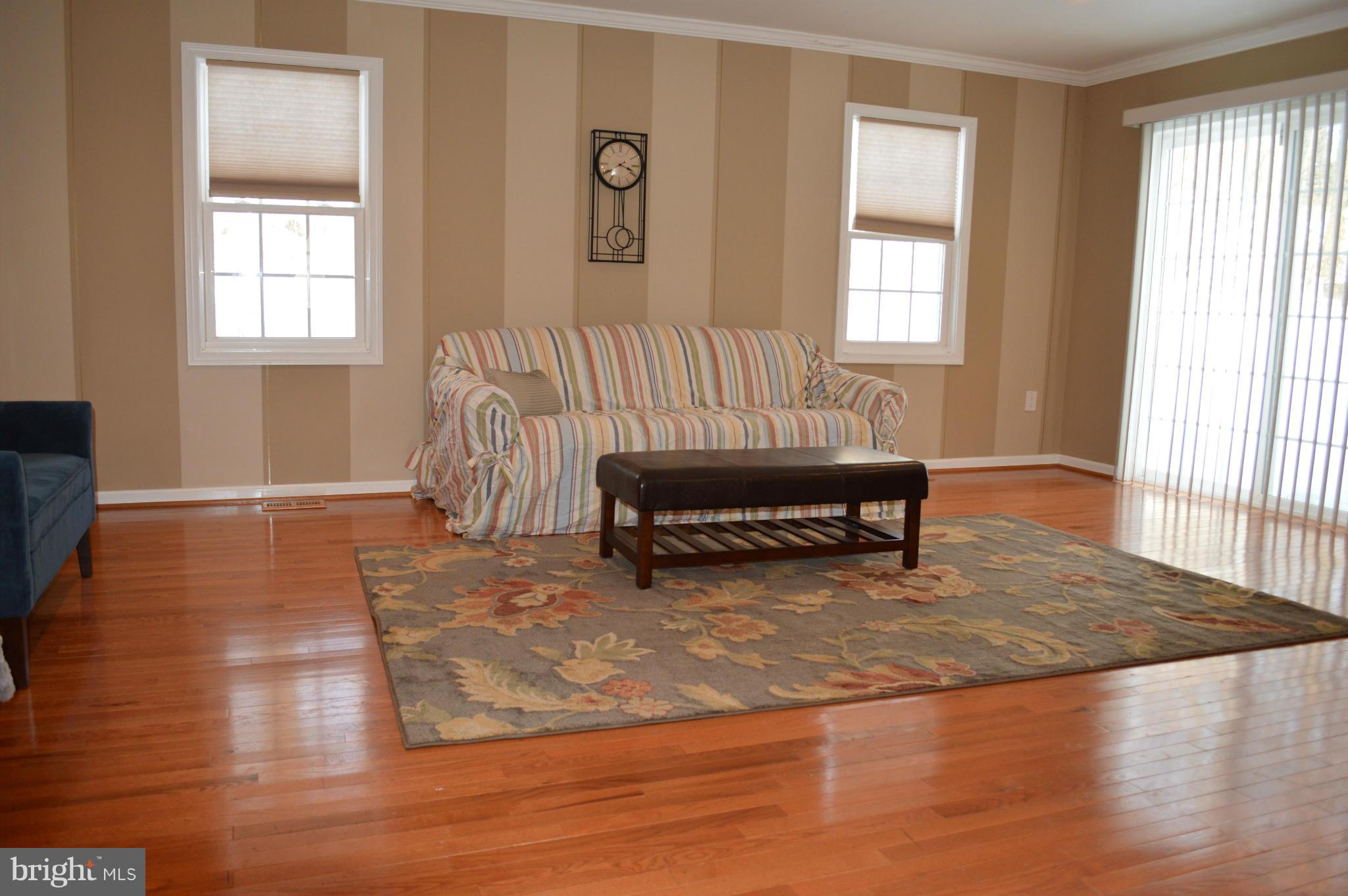 6111 Western Run Drive Baltimore, MD 21209 - Photo 4 of 27 a living room with furniture and a window