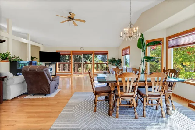 a view of a dining room with furniture wooden floor and chandelier