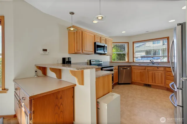 a kitchen with a sink cabinets and window