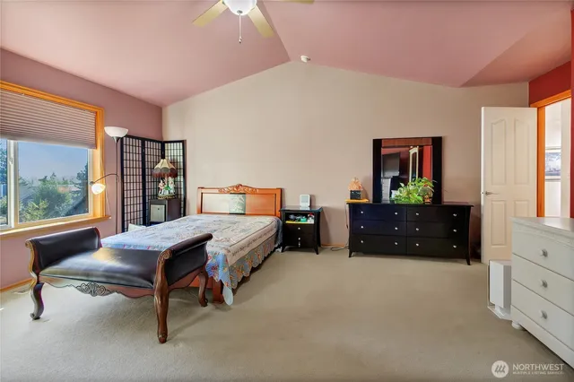 a bedroom with a bed and a dresser