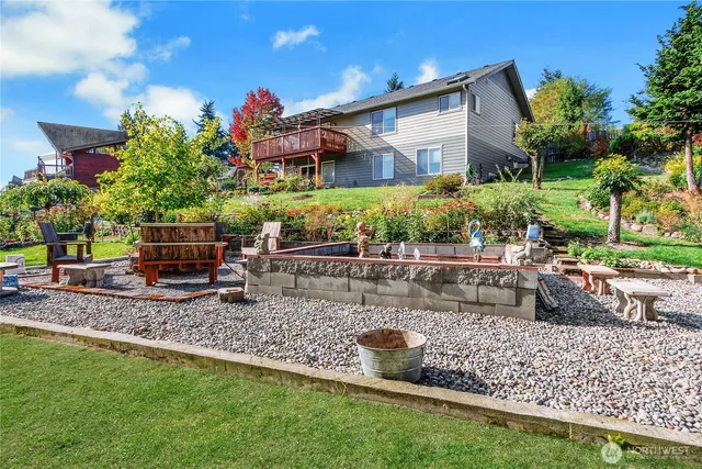 a view of a house with a flower garden