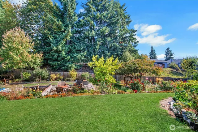 a view of yard with seating area and green space