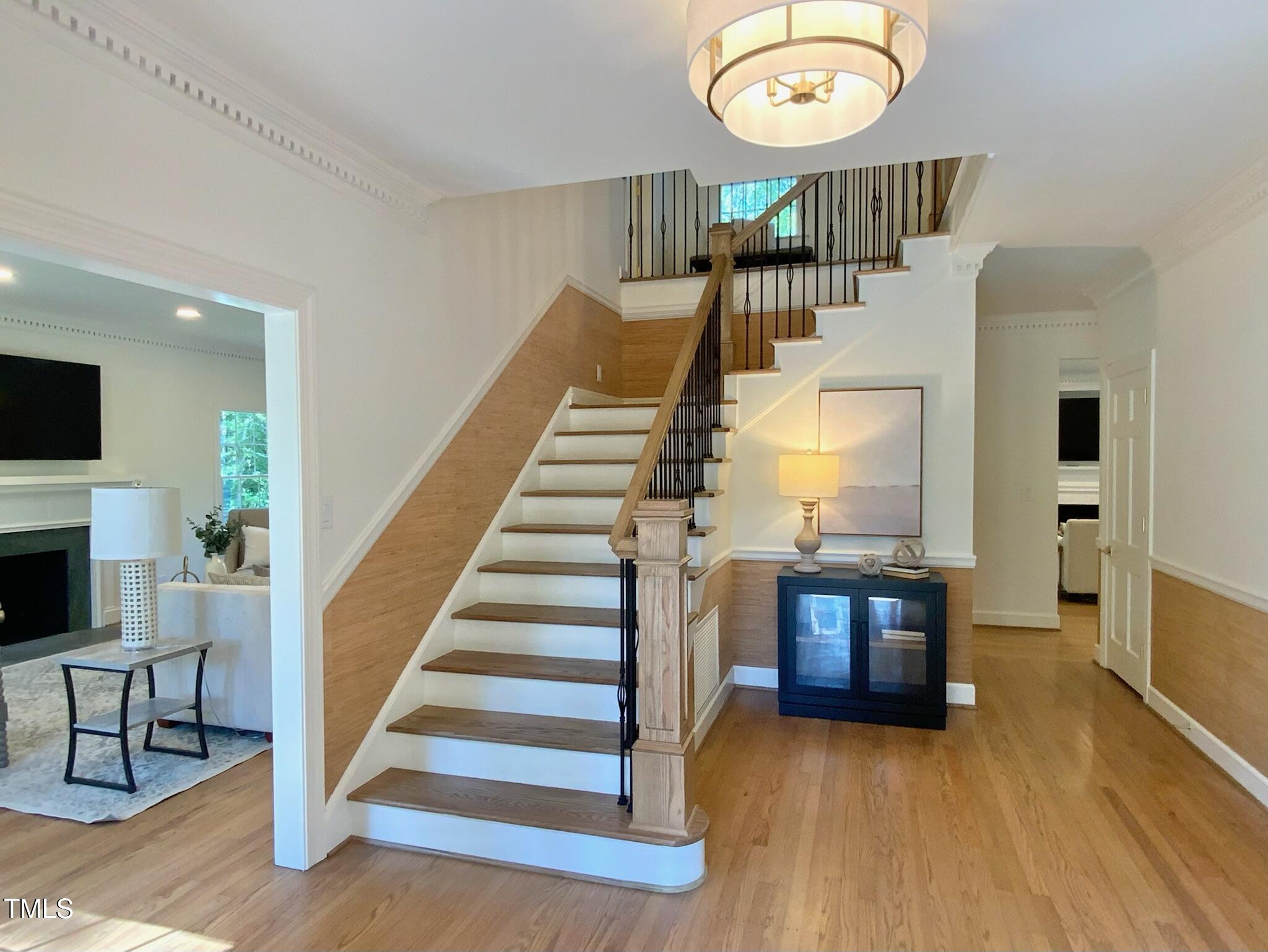 3838 Regent Road Durham, NC 27707 - Photo 16 of 55 a view of entryway and hall with wooden floor