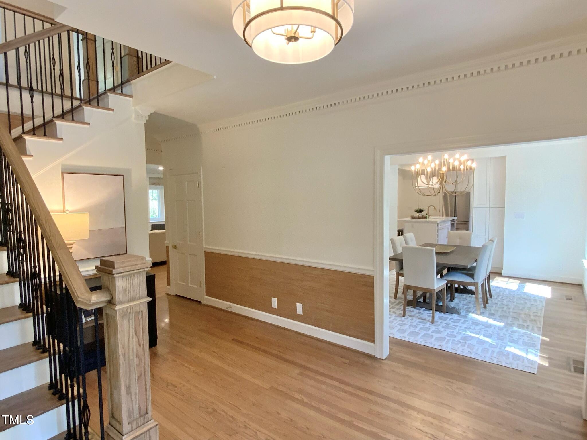 3838 Regent Road Durham, NC 27707 - Photo 17 of 55 a view of entryway and hall with wooden floor