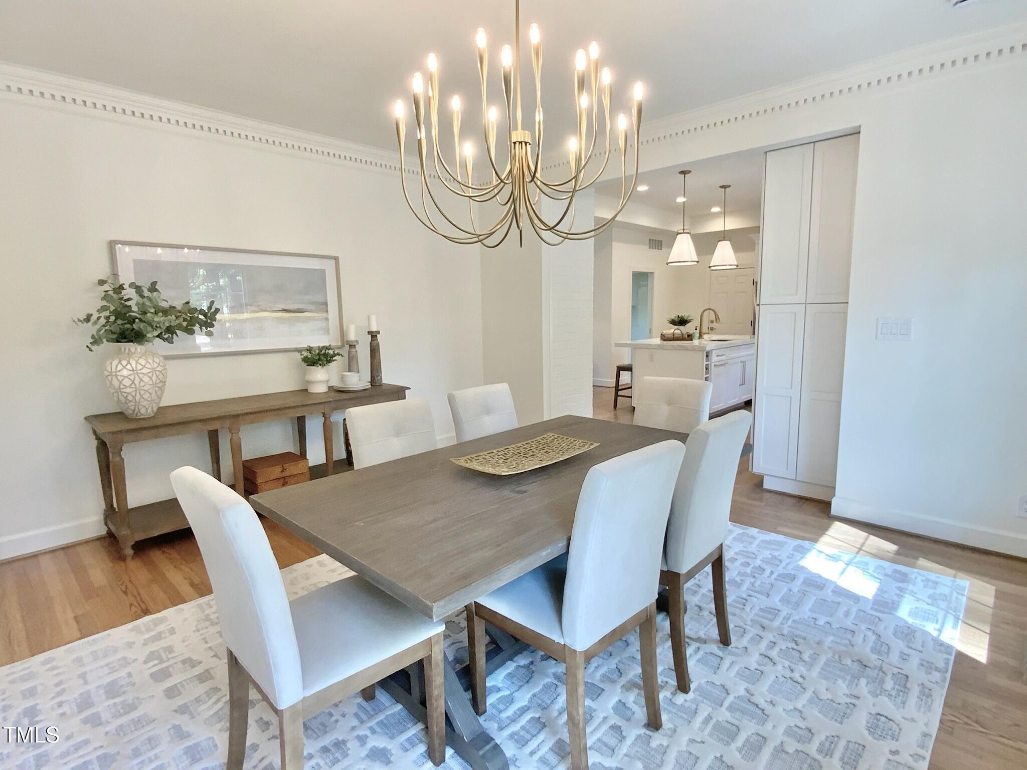 3838 Regent Road Durham, NC 27707 - Photo 22 of 55 a view of a dining room with furniture and wooden floor
