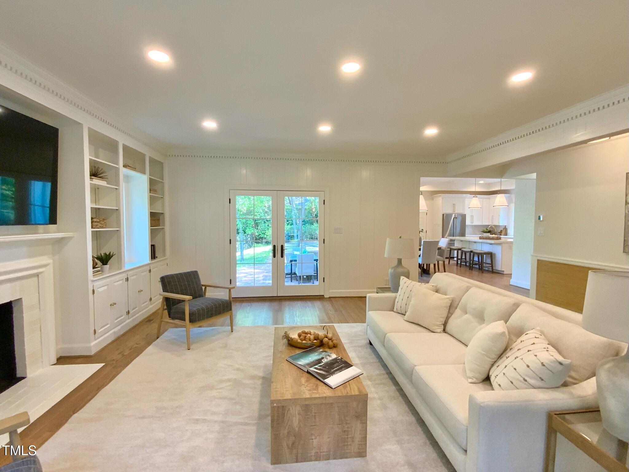 3838 Regent Road Durham, NC 27707 - Photo 24 of 55 a living room with furniture and a large window