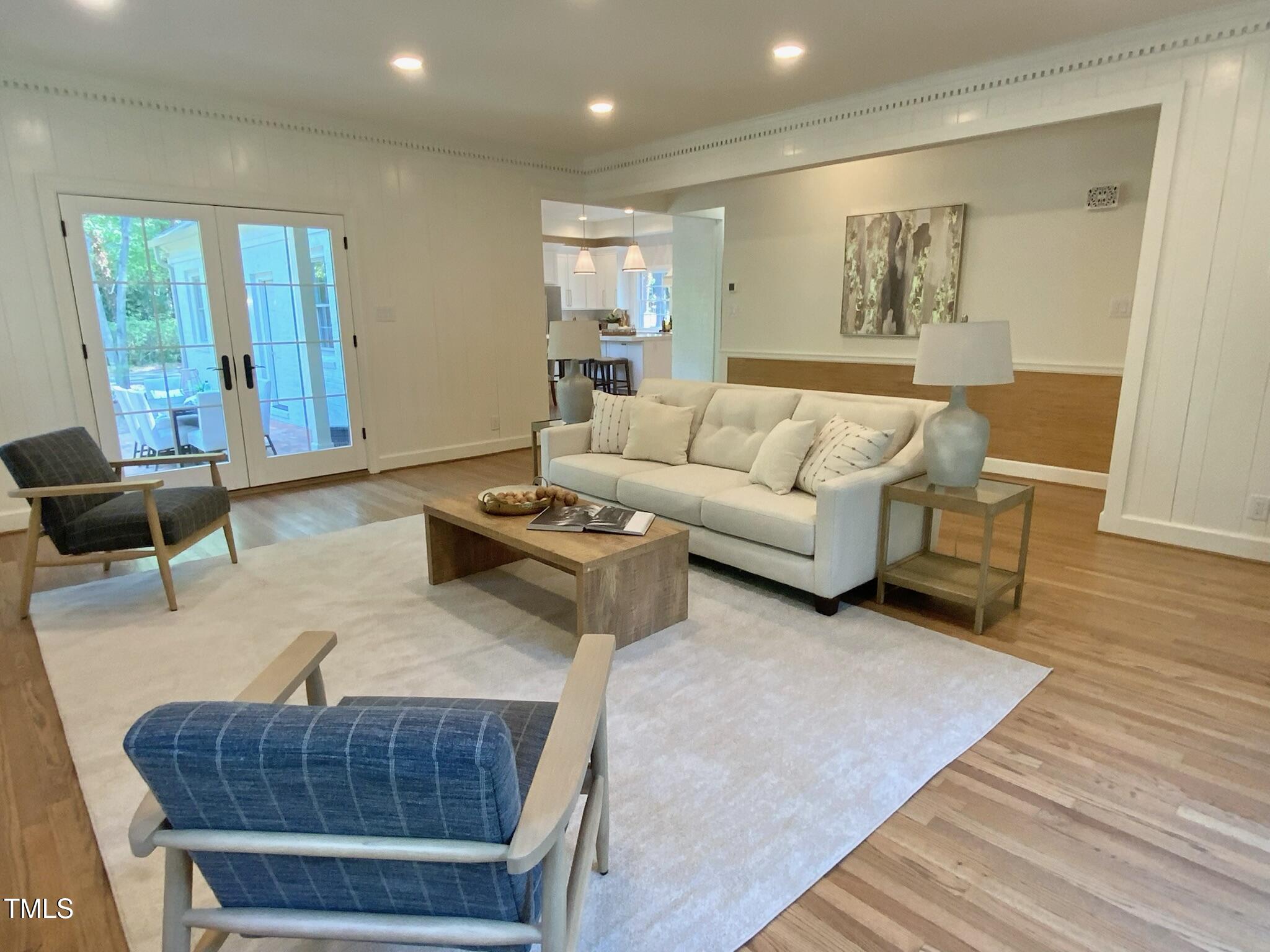 3838 Regent Road Durham, NC 27707 - Photo 26 of 55 a living room with furniture and wooden floor