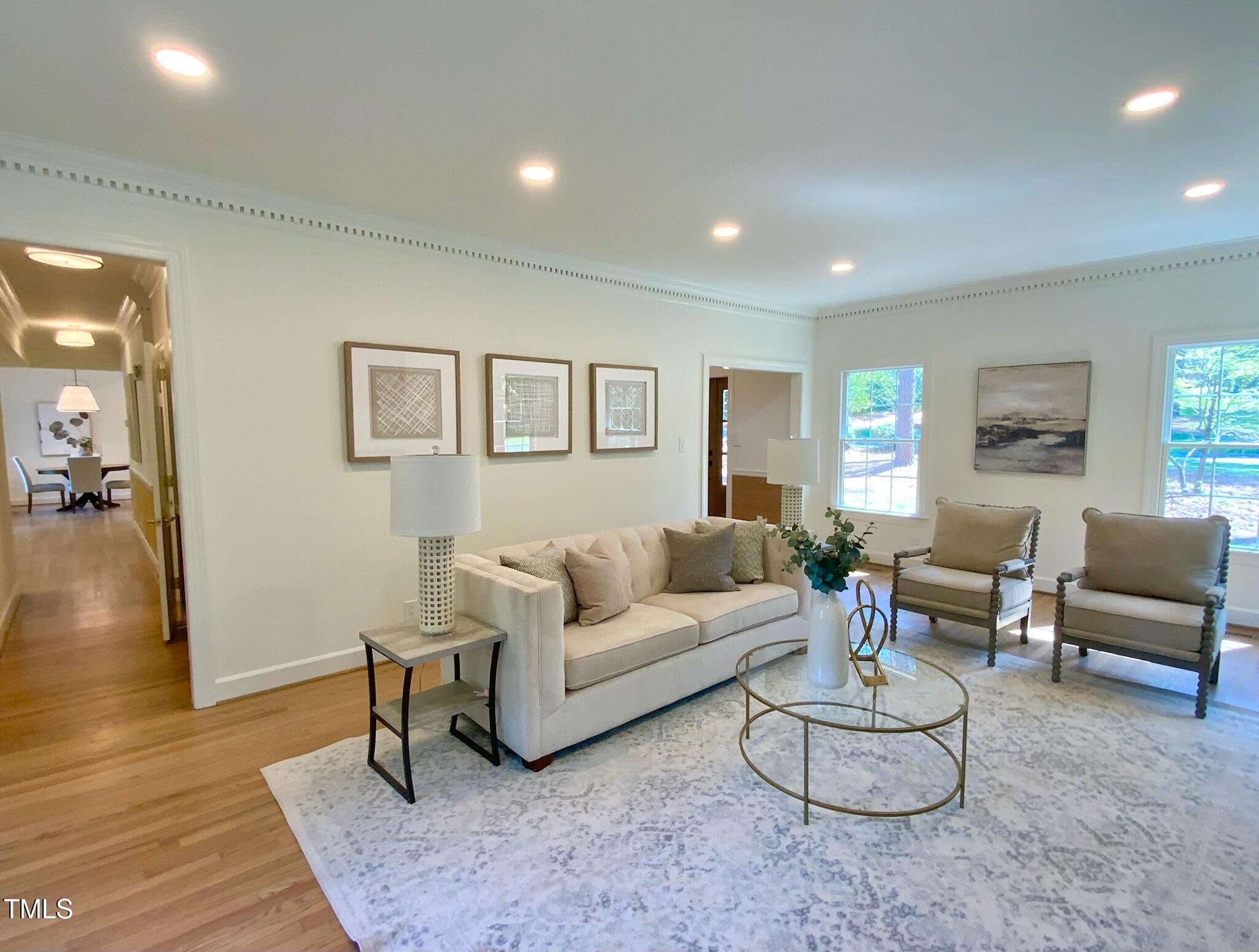 3838 Regent Road Durham, NC 27707 - Photo 28 of 55 a living room with furniture and a wooden floor