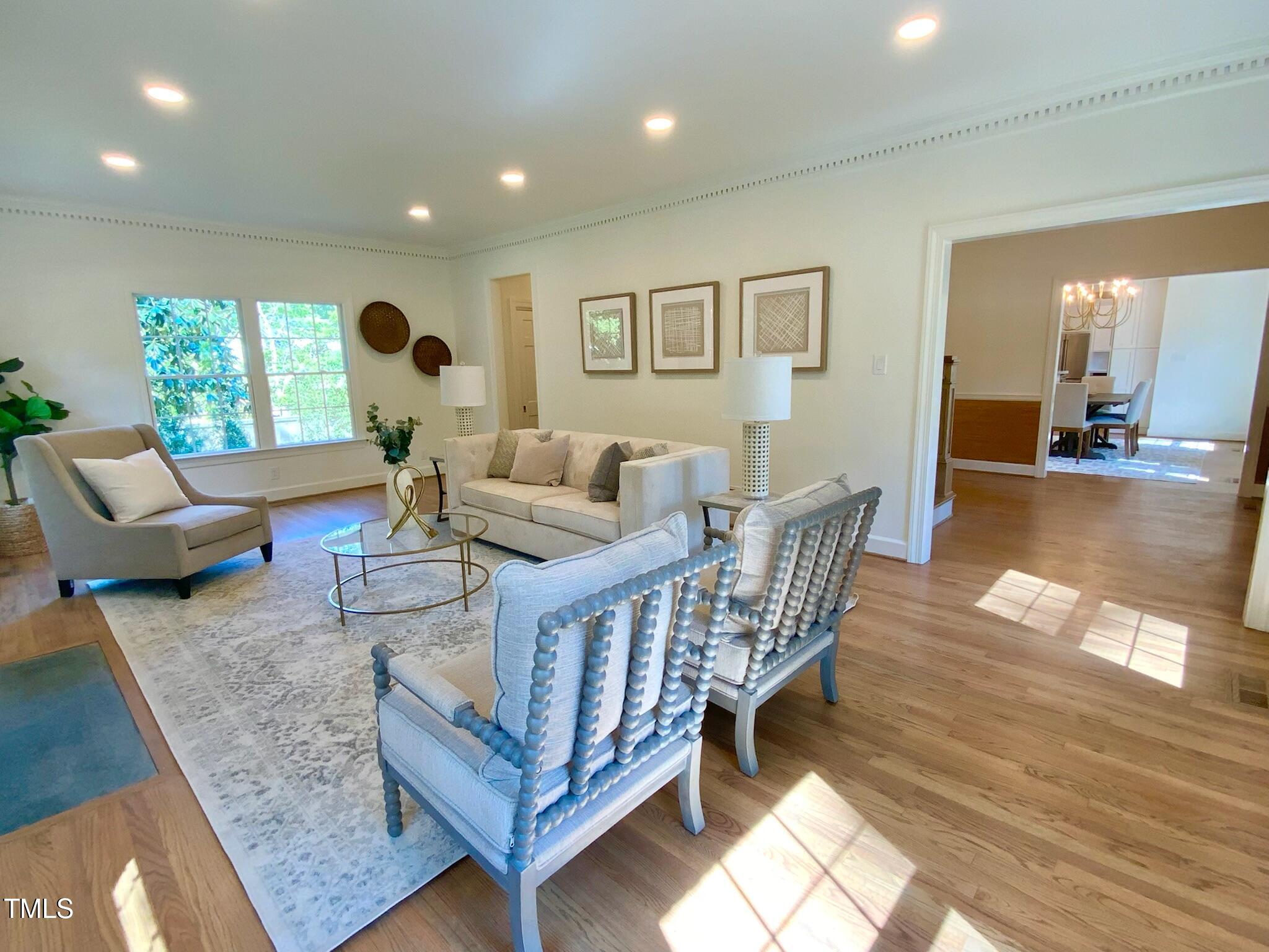 3838 Regent Road Durham, NC 27707 - Photo 29 of 55 a living room with furniture and a wooden floor