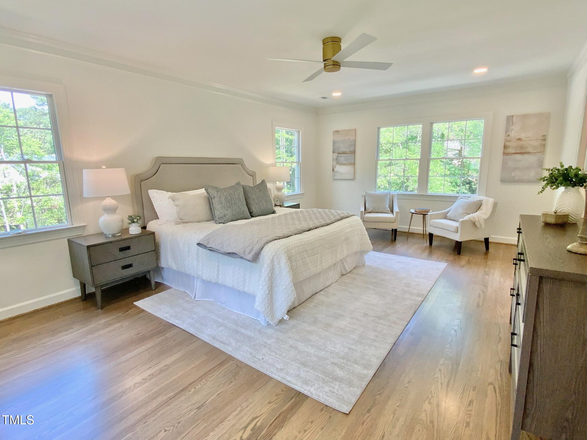 3838 Regent Road Durham, NC 27707 - Photo 33 of 55 a spacious bedroom with a large bed and a couch
