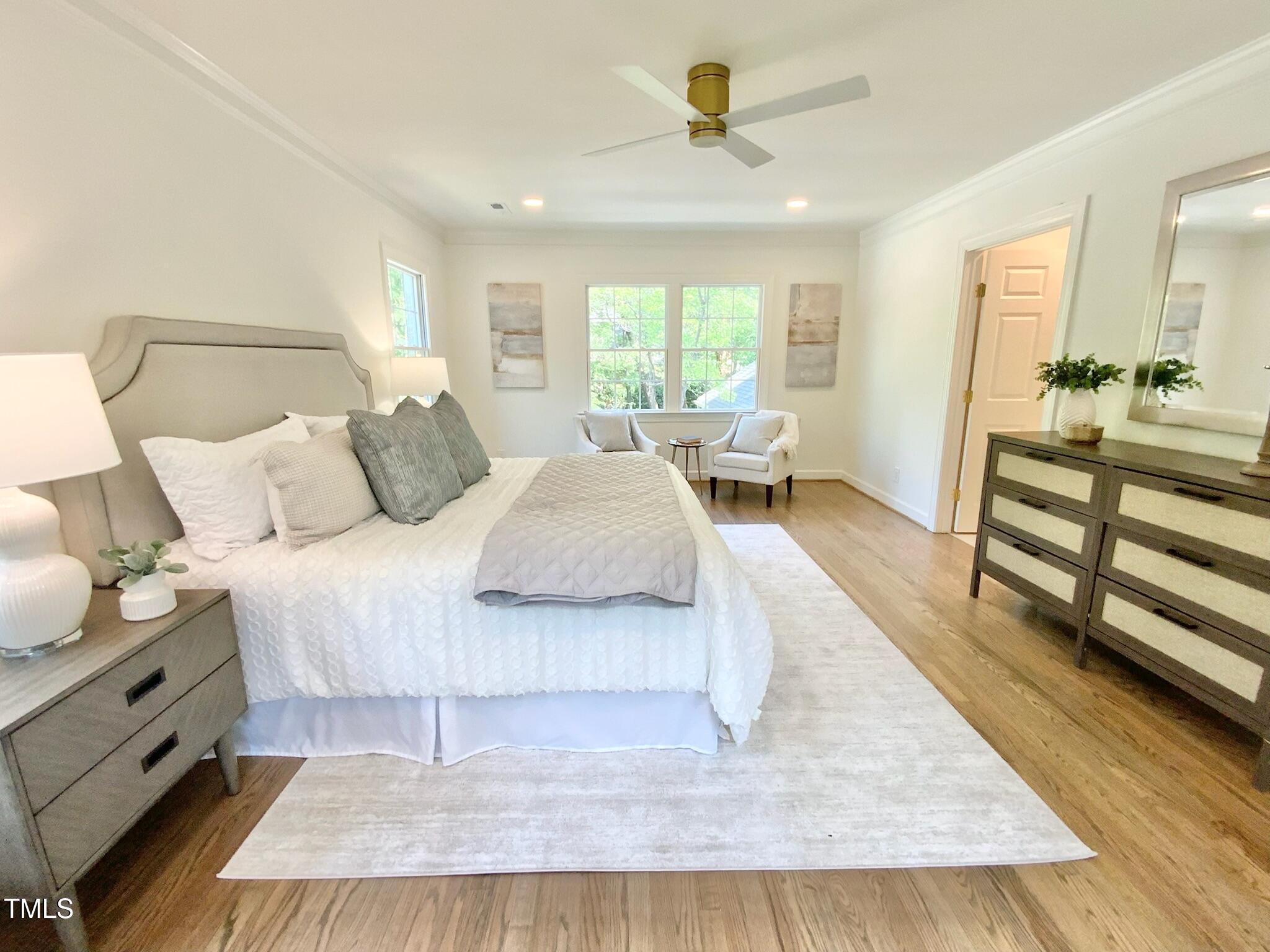 3838 Regent Road Durham, NC 27707 - Photo 34 of 55 a bedroom with a bed and wooden floor
