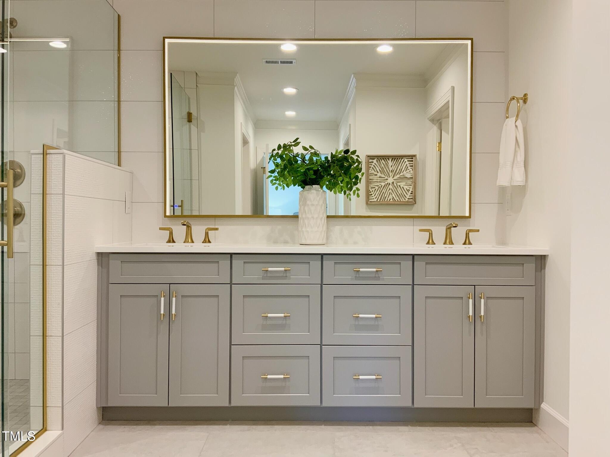 3838 Regent Road Durham, NC 27707 - Photo 36 of 55 a bathroom with a sink vanity and mirror