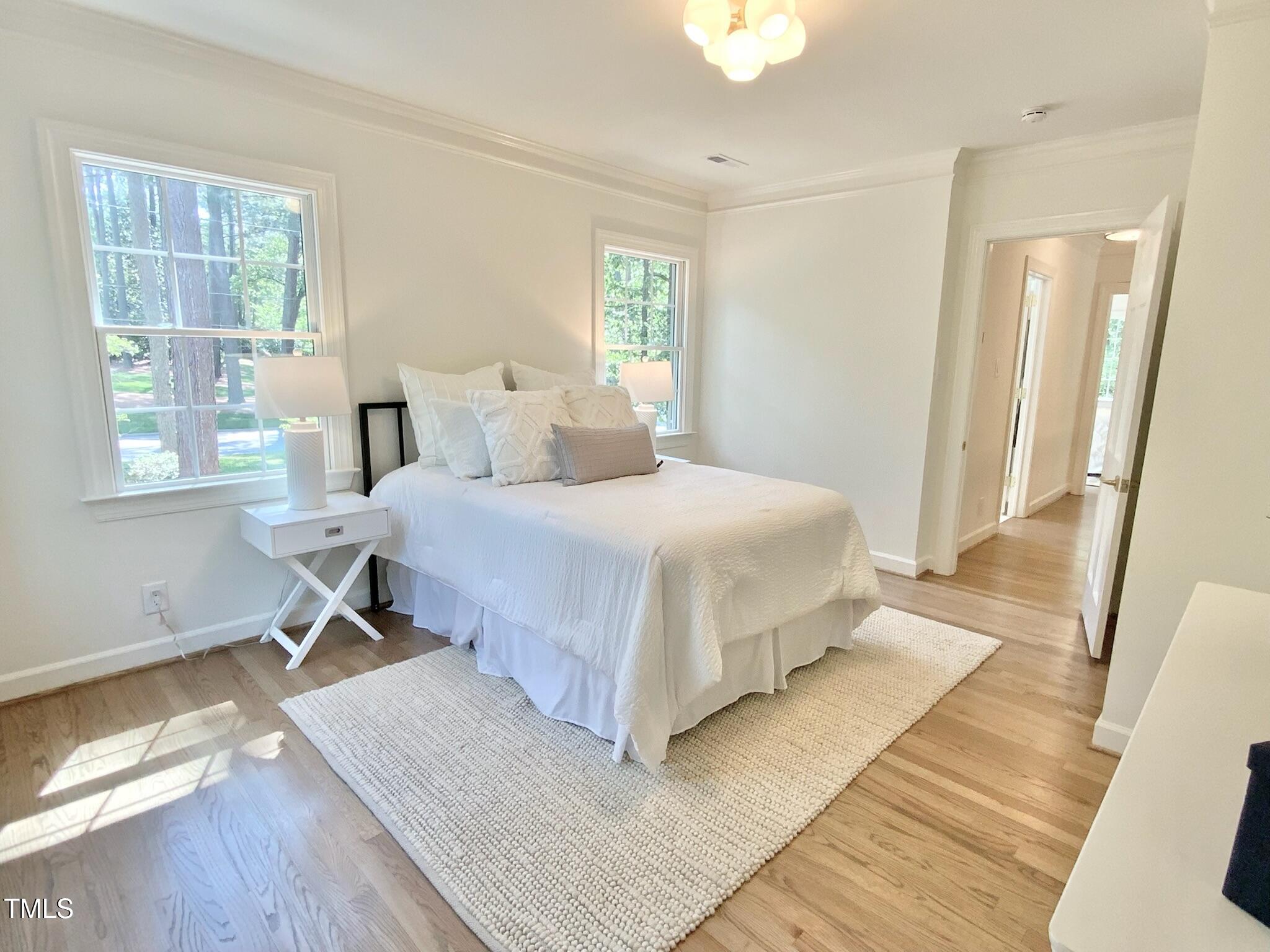 3838 Regent Road Durham, NC 27707 - Photo 40 of 55 a bedroom with a large bed and a window