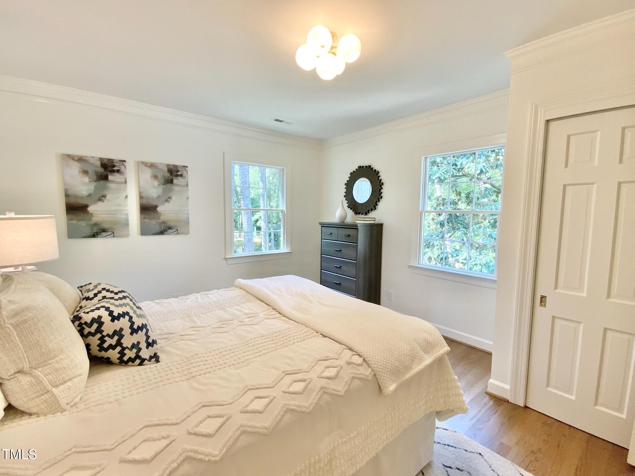 3838 Regent Road Durham, NC 27707 - Photo 42 of 55 a bedroom with a bed and a window