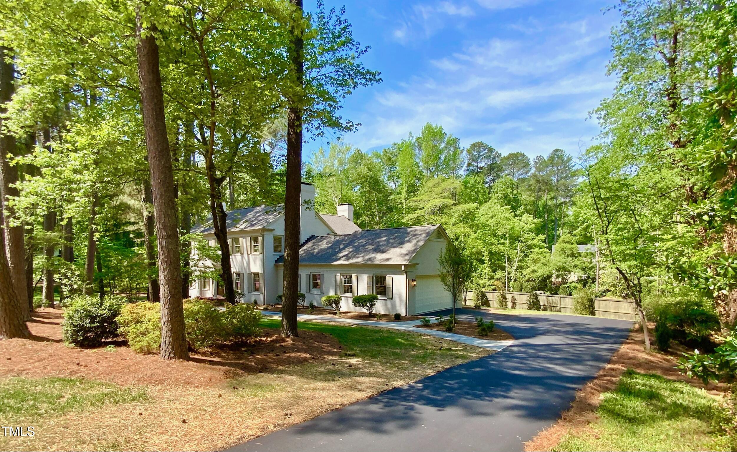 3838 Regent Road Durham, NC 27707 - Photo 5 of 55 a front view of a house with garden