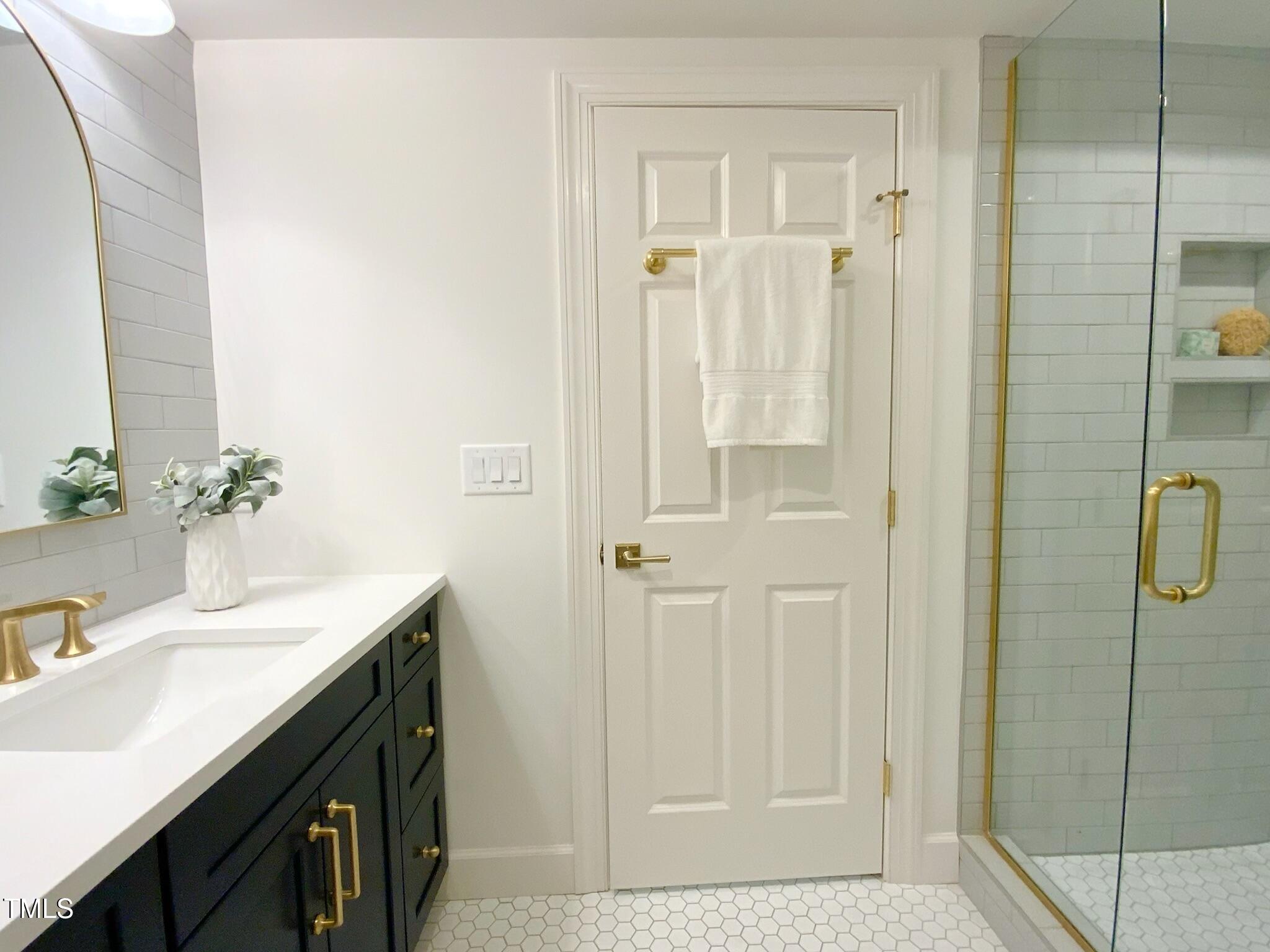 3838 Regent Road Durham, NC 27707 - Photo 51 of 55 a bathroom with a sink and a mirror