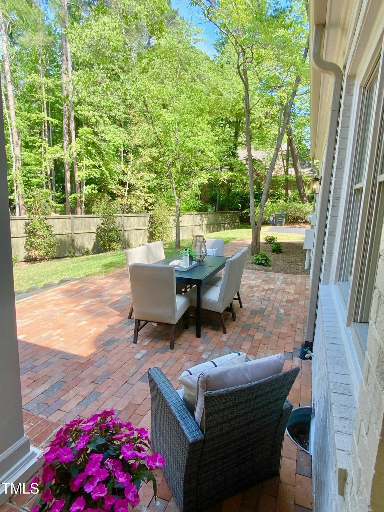 3838 Regent Road Durham, NC 27707 - Photo 9 of 55 a roof deck with table and chairs and potted plants